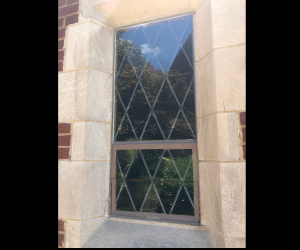 stained glass protective covering on a church using tempered glass